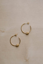 Load image into Gallery viewer, Flower knot hoops, gold hoop earrings, dainty gold hoops, star knot hoops, unique hoops, boho hoops, stacking hoops, medium hoops