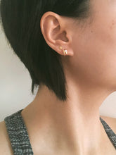 Load image into Gallery viewer, Tiny huggie pearl hoop, crossover effect, mini huggie earrings, dainty pearl, mini hoops, wedding bridal pearl, bridal gift, 925 silver